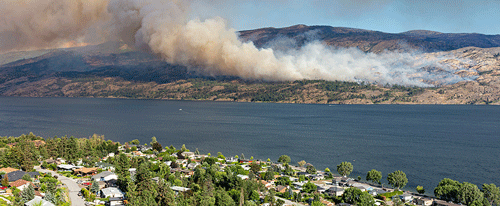brush fire approaching homes