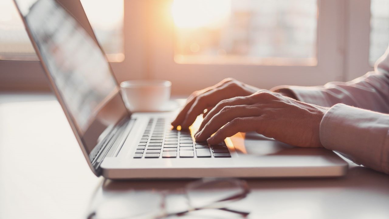 person on laptop searching a surety bond vs a letter of credit