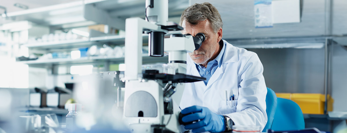 man with microscope