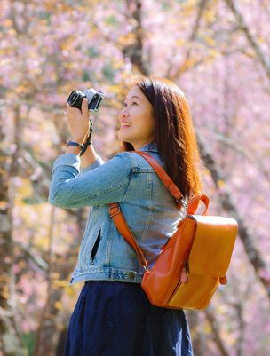 woman with sakura backdrop